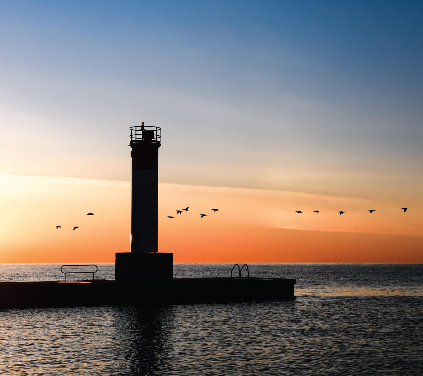 Sunset view of lighthouse at Oakville Pier.